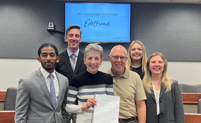 Group of International Trade Center interns pose with company representatives