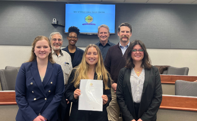 Group of International Trade Center interns pose for a photo after final presentations