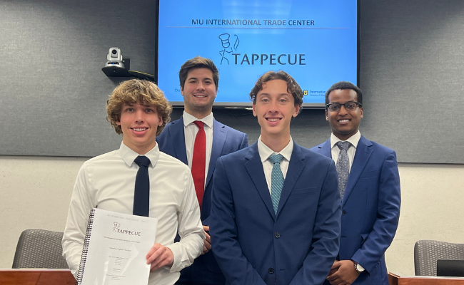 Group of International Trade Center interns pose after final presentation