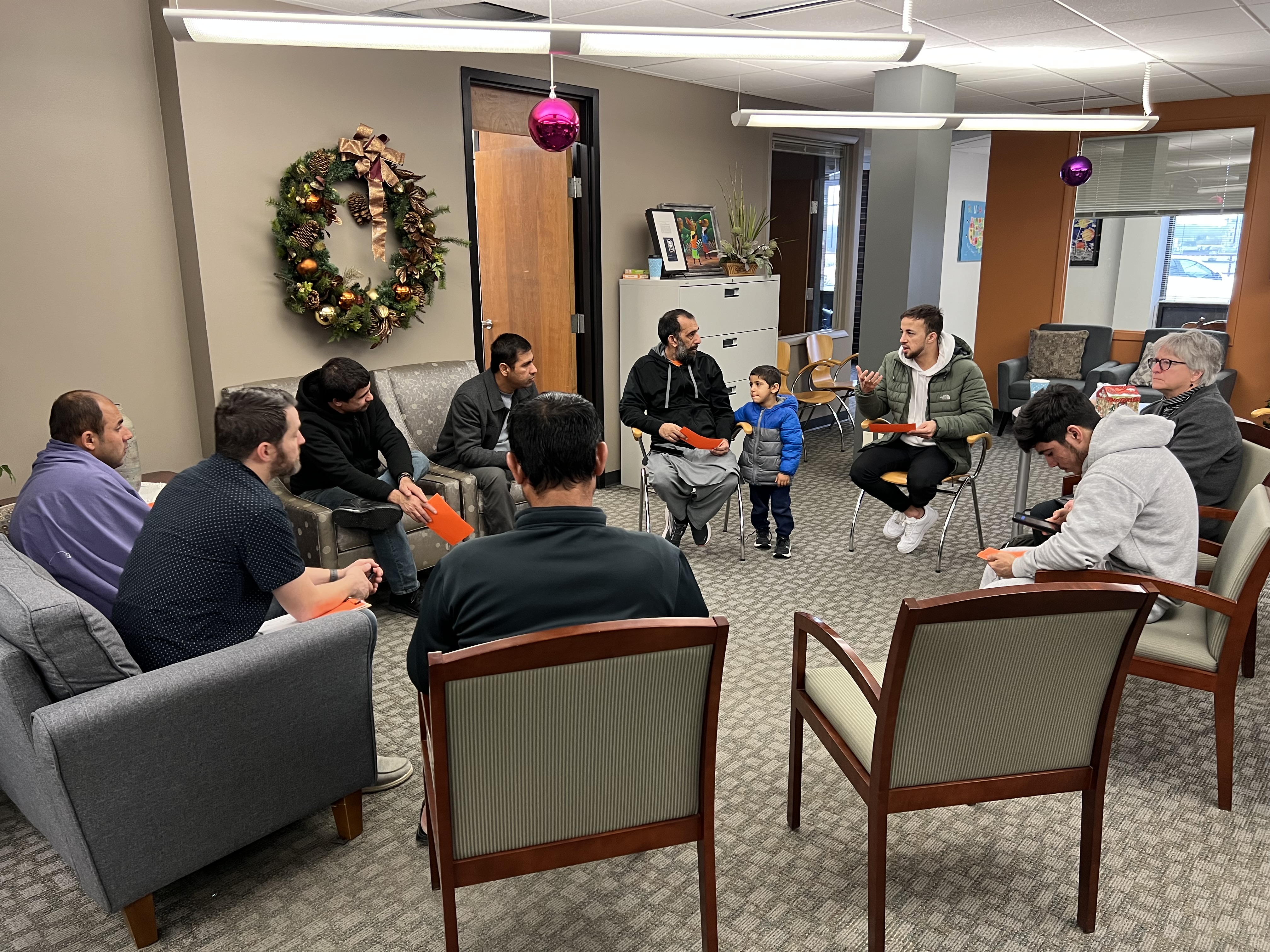 Sadat talks with Afghan refugees at City of Refuge.