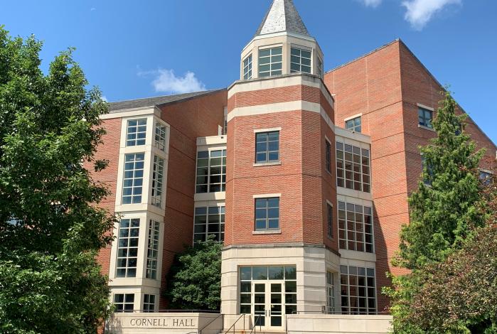 Image: Conference room with chairs and a large table, light streaming through the windows