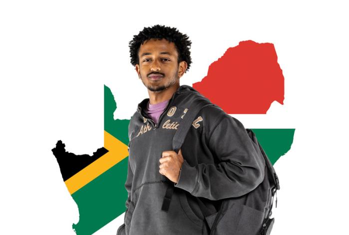 Photo of Nez Redi holding his backpack