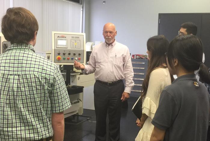 Photo: MU ITC students and Tom Dustman during a site visit and initial project meeting – JPEG File attached.