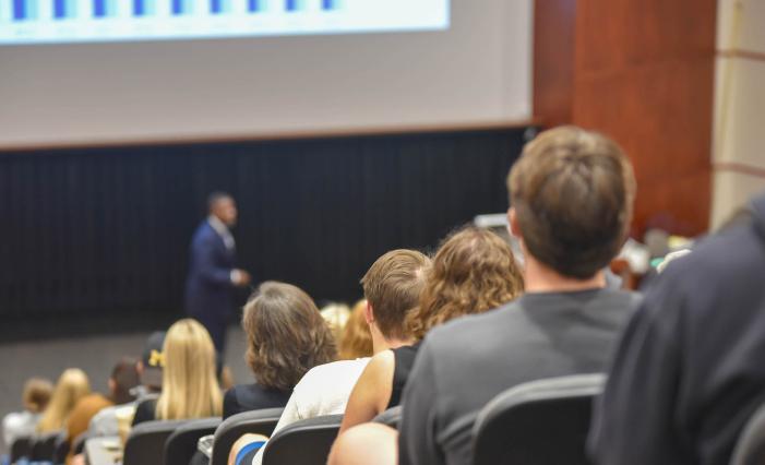 Image: students listening to speaker