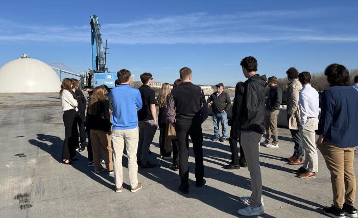 Students listening to Richard Greville, vice president of multimodal logistics at Port KC. He shares insights into the new Missouri River Terminal initiative